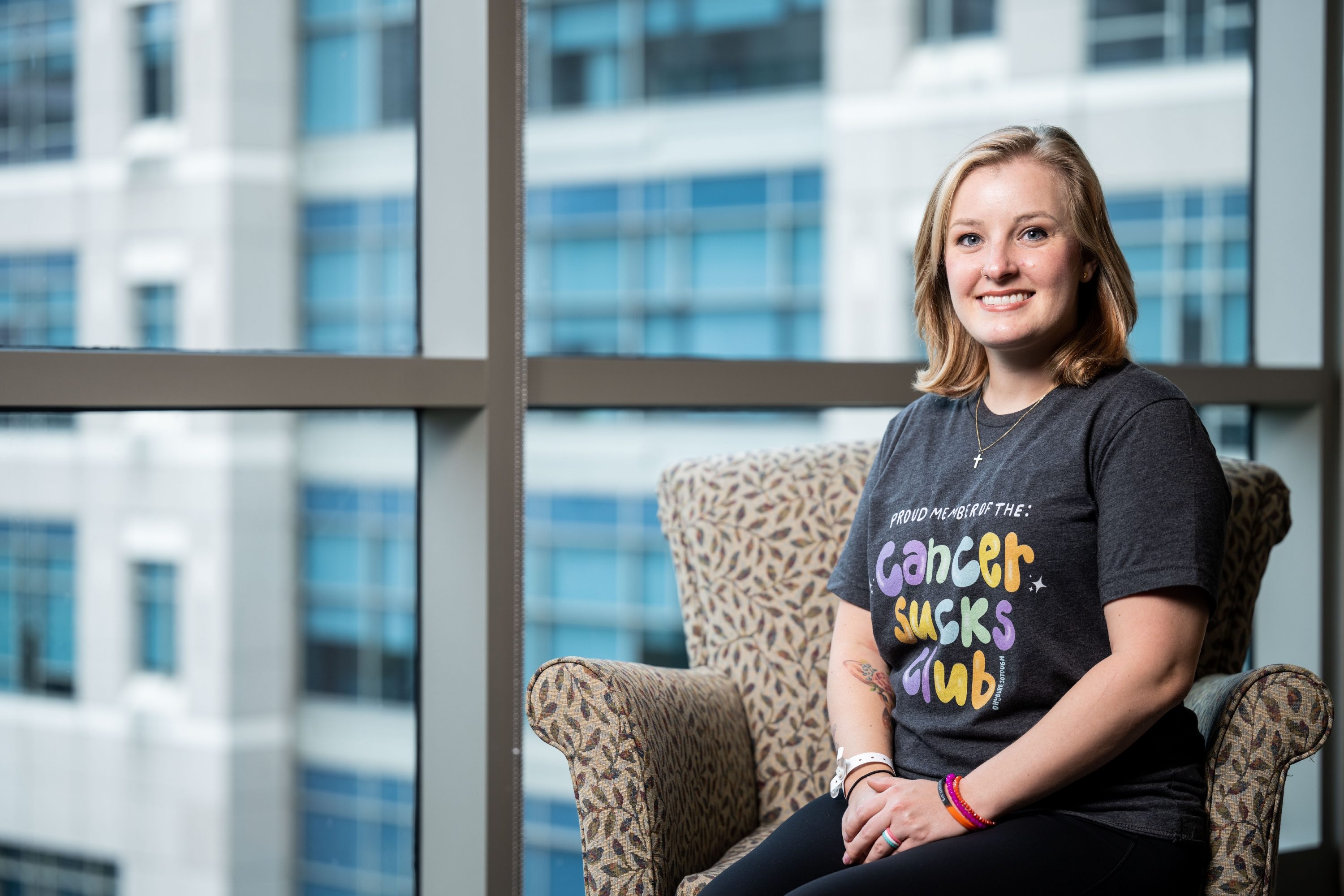 Image of breast cancer patient Olivia Franz seated at MD Anderson 