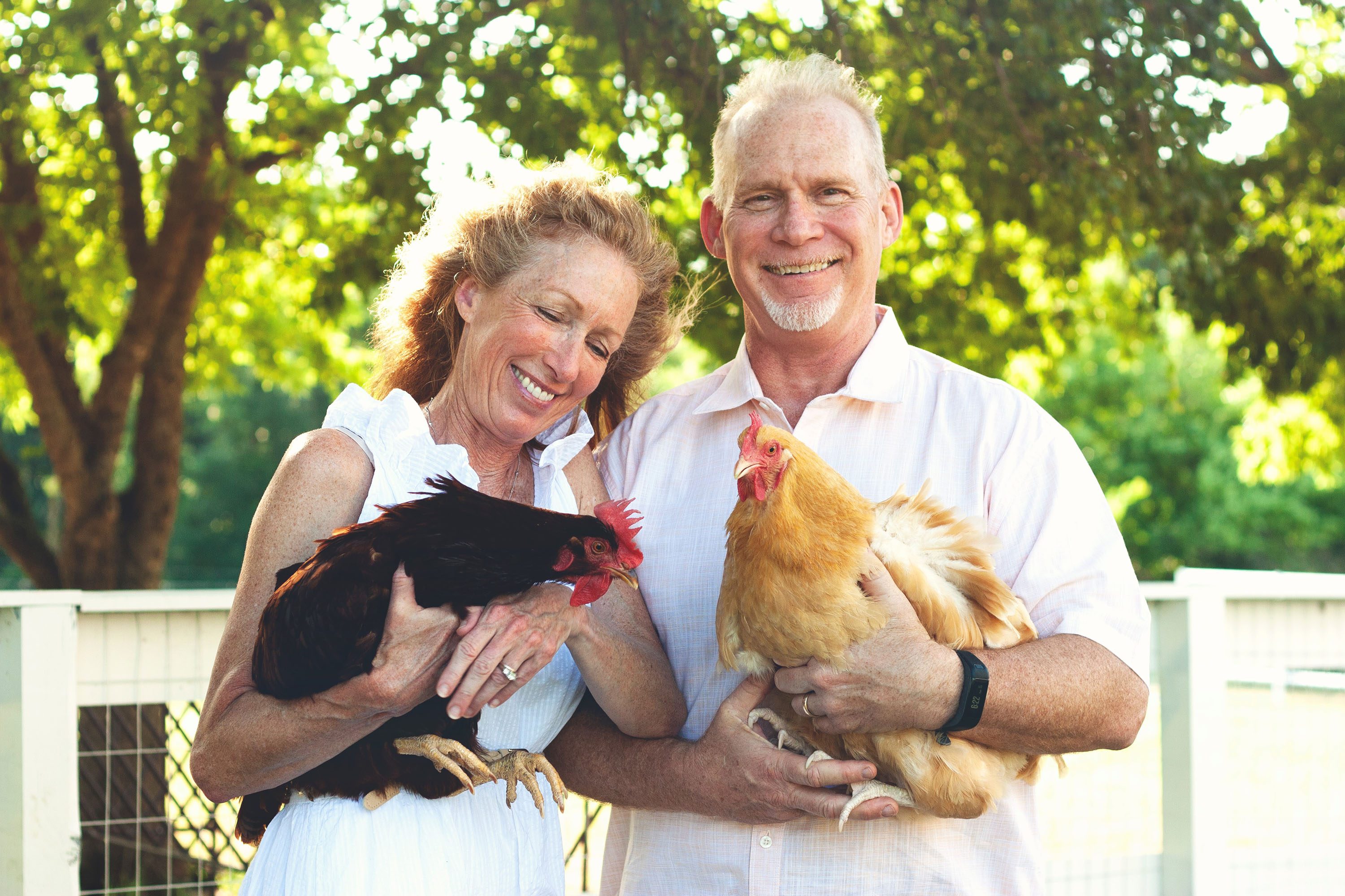 Cyndi and David Graves hold their chickens