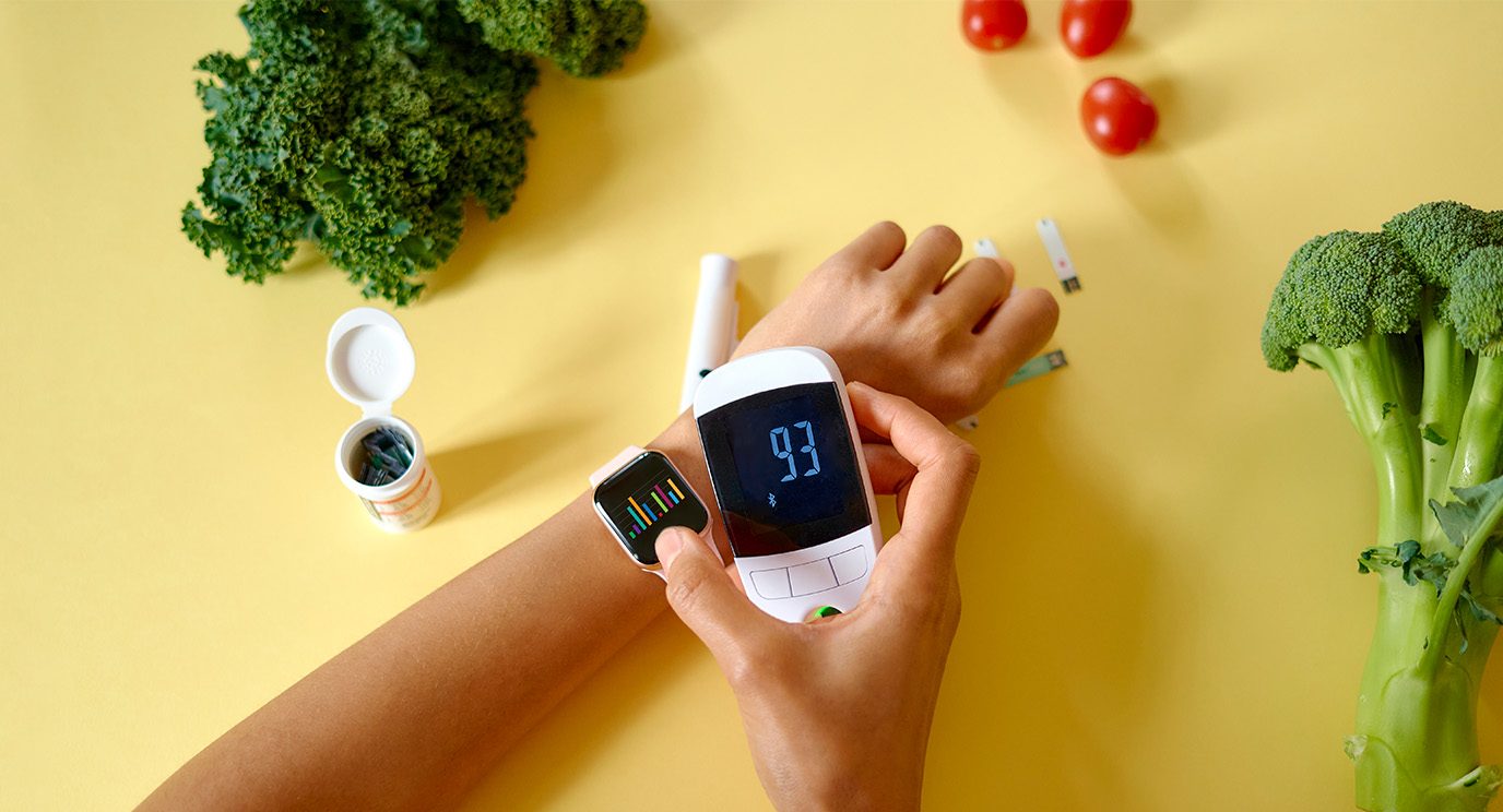 Person using a smartwatch to check their blood sugar