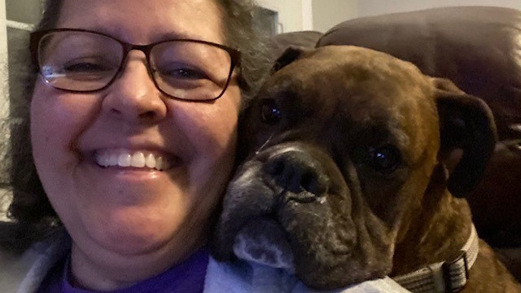 Breast cancer survivor Debbie Mendoza with her dog