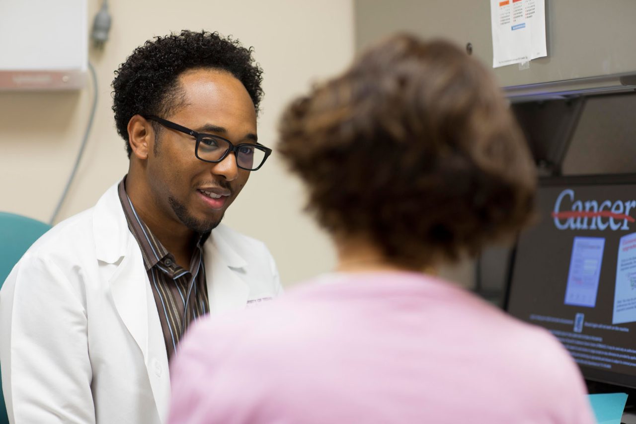 Cancerwise blog photo: Senior research nurse Franklin Wynn speaks with a patient.