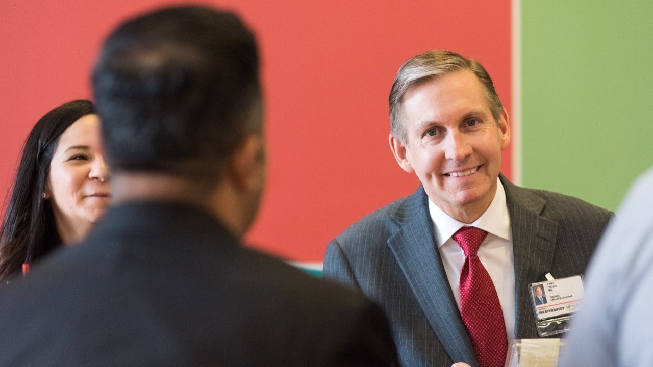 MD Anderson president Peter WT Pisters, M.D., smiles during a meeting with staff