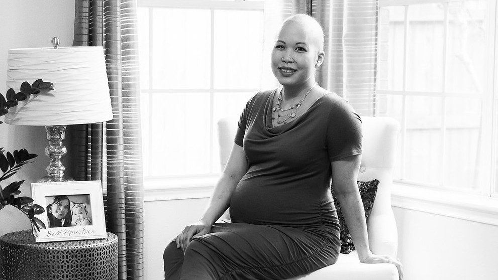 Non-Hodgkin's lymphoma survivor Allie Moreno poses while pregnant