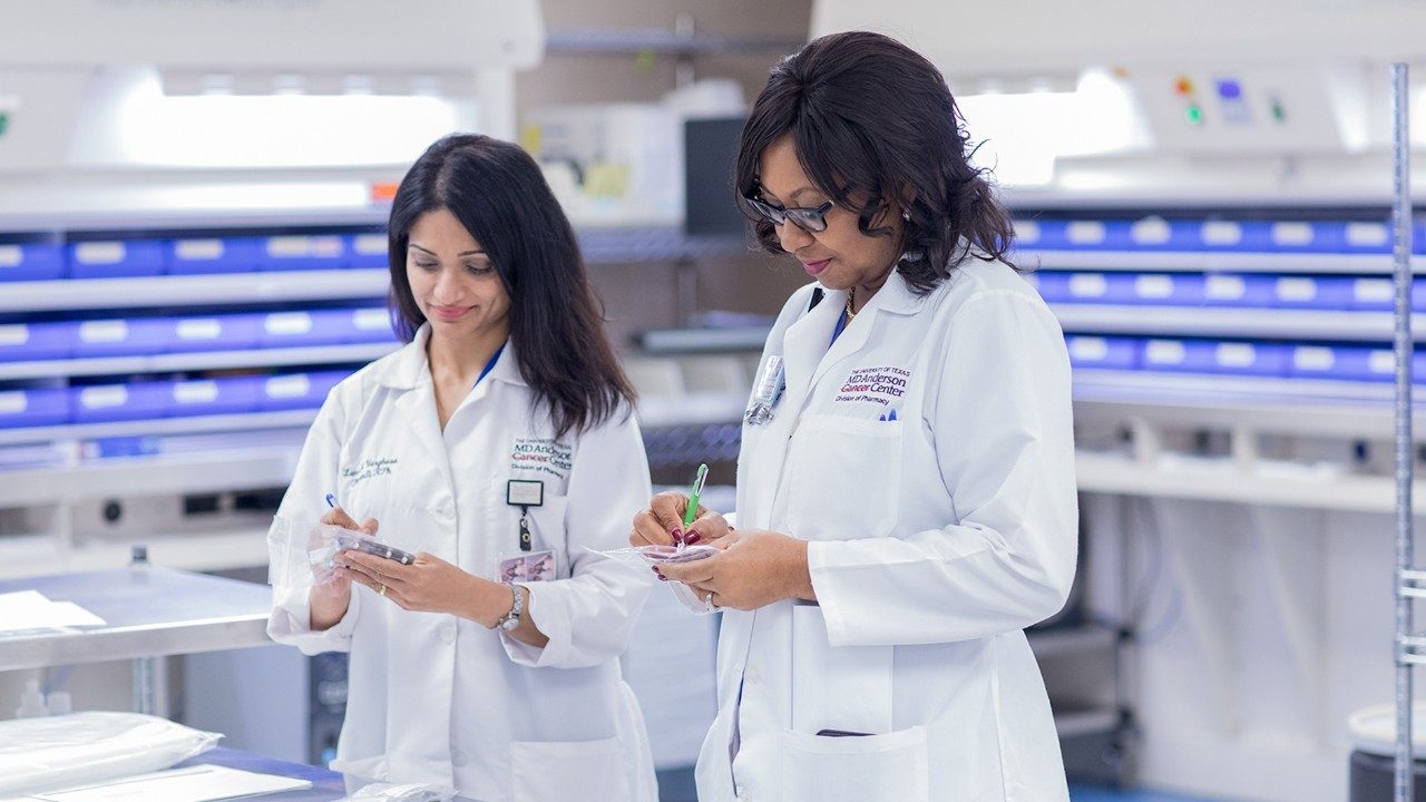 Inpatient pharmacists Mariamma (Leni) Varghese, Pharm.D., left, and Ifeoma Okafor, Pharm.D, review medications.