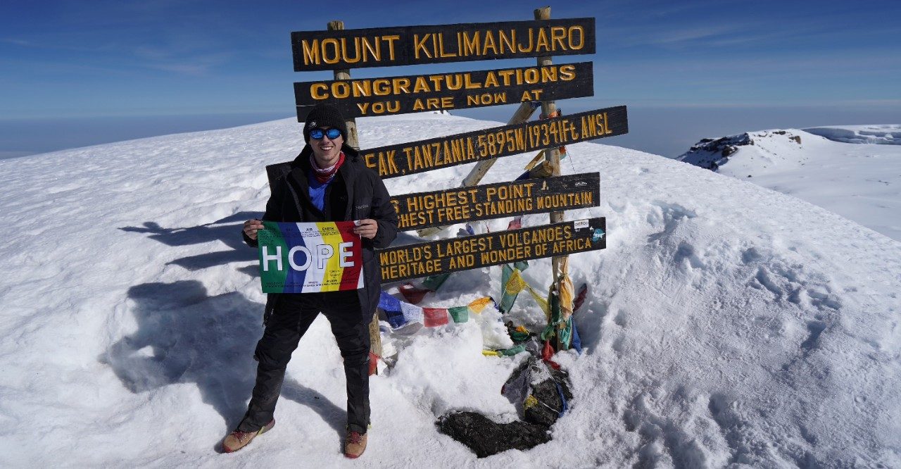 Testicular cancer survivor JMichael Shipman, atop Mt. Kilimanjaro