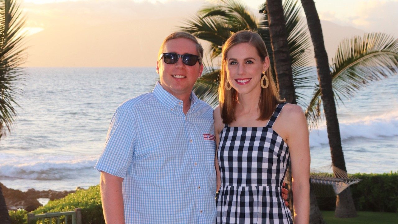 Caregiver Allison Hemer Jochetz with her husband, glioblastoma survivor, John, posing on a beach