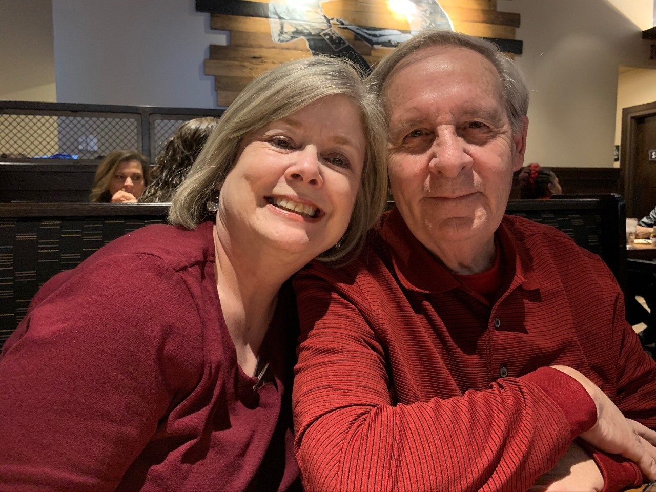 Jo Ann Foster (left) with her husband, Gary, on the right, pose for a photo