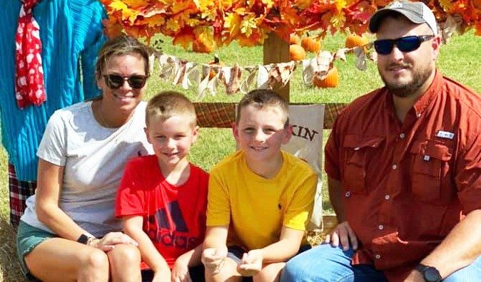 Tongue cancer survivor Shelley Varnado with her husband and sons