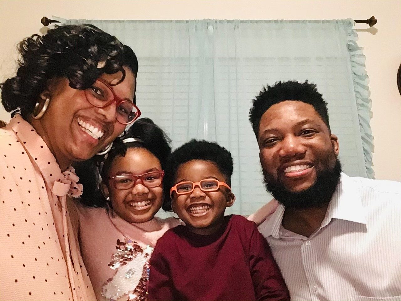 Colorectal cancer survivor Al Thomas with his wife, Demetria, and their kids