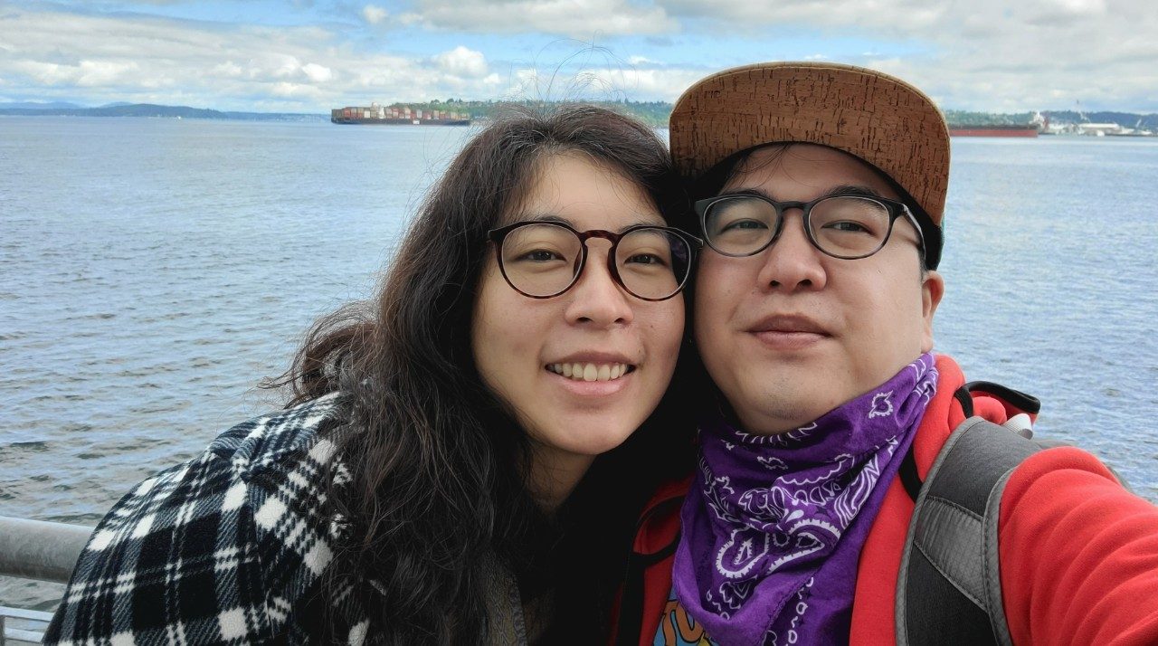 Jonathan Ting and his wife, Cecilia Yeung standing in front of a lake