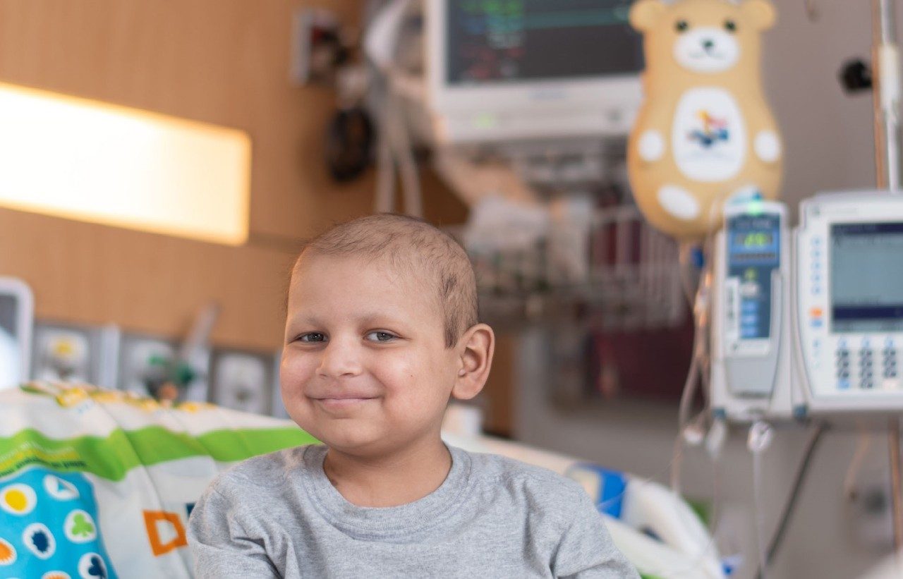 Giovanni Albelice sitting in a hospital room.