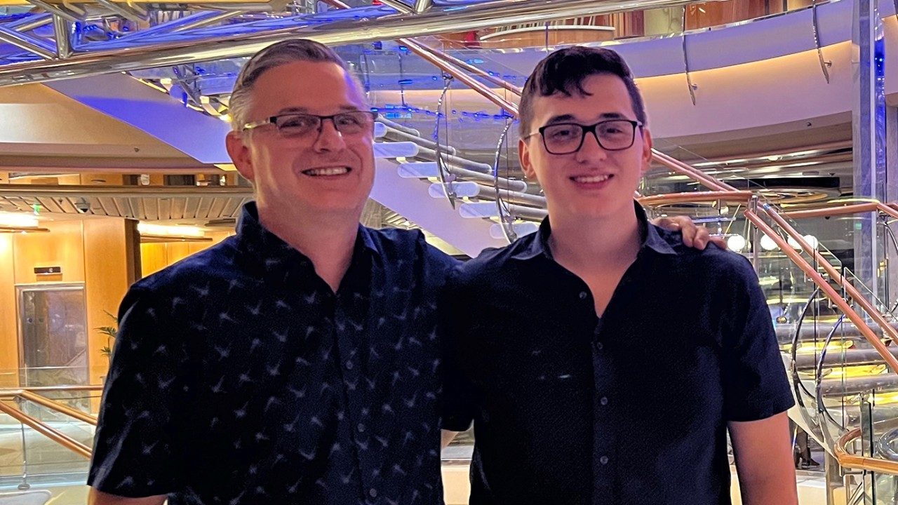 Student extern and blood donor Fernando Langer stands with arm around his late father, Harald