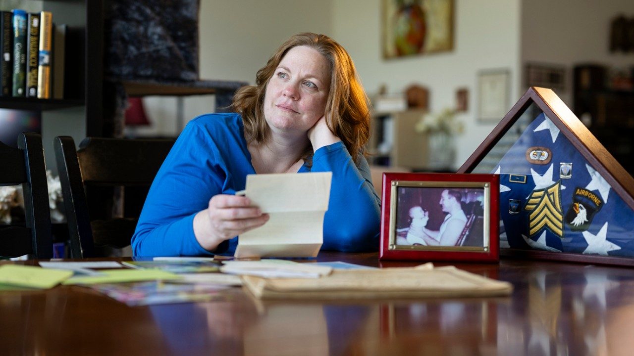 Clinical Nutrition Manager Rebekah Crowder contemplates mementos of her father at her home