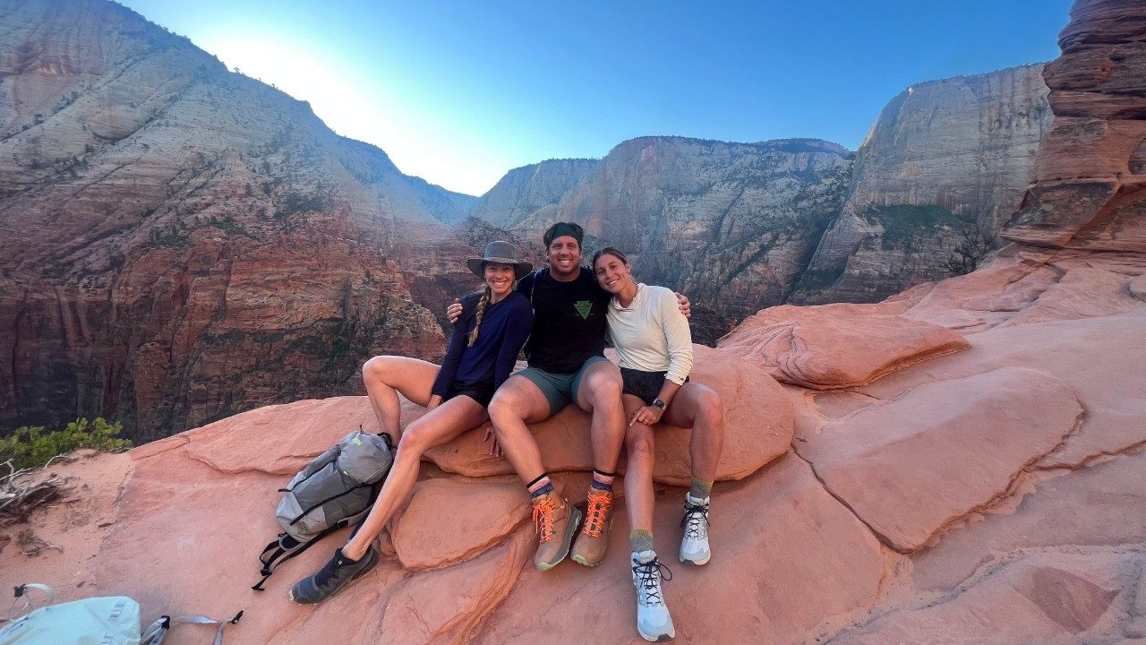 Clark with his sister, Caroline, on the left, and wife, Mallory on the right. 