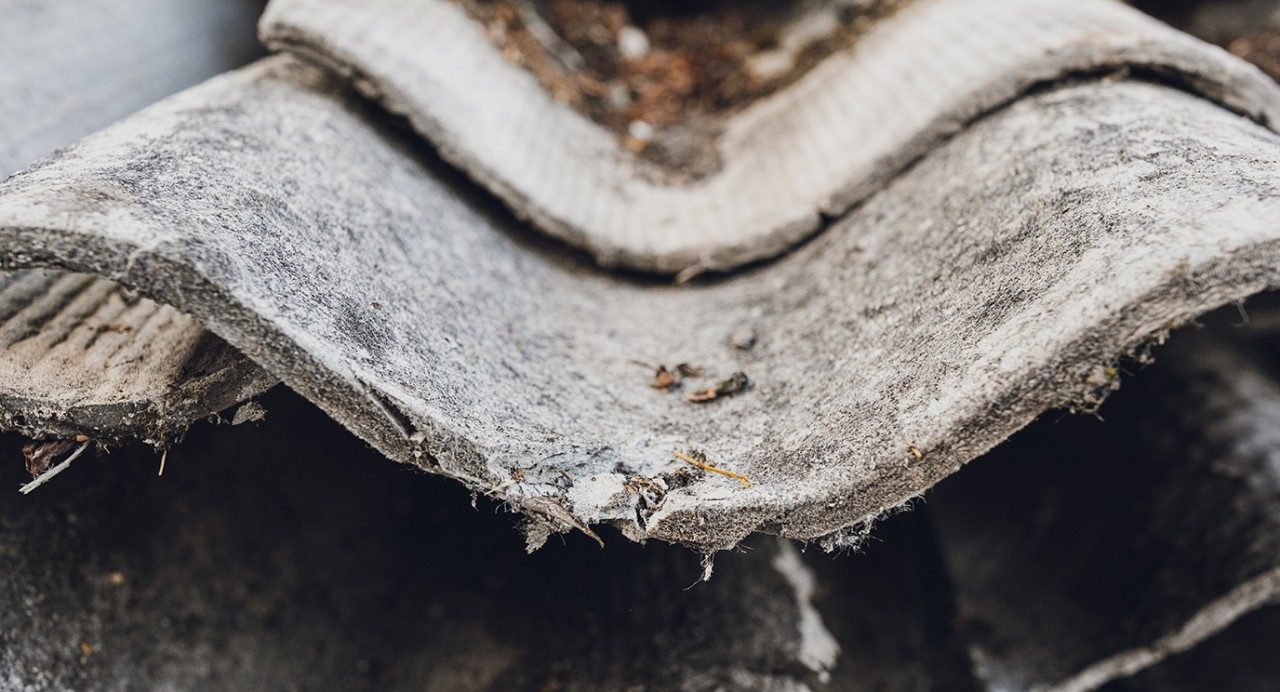 Close-up view of roofing tiles containing asbestos fibers