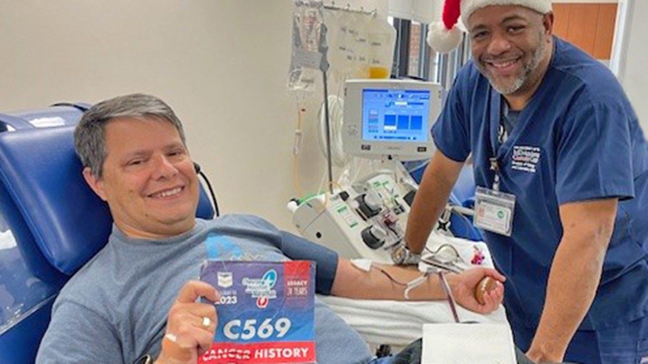 Ben Mayer (left) celebrates being able to donate blood again with senior blood donor technician Donald McKinnon