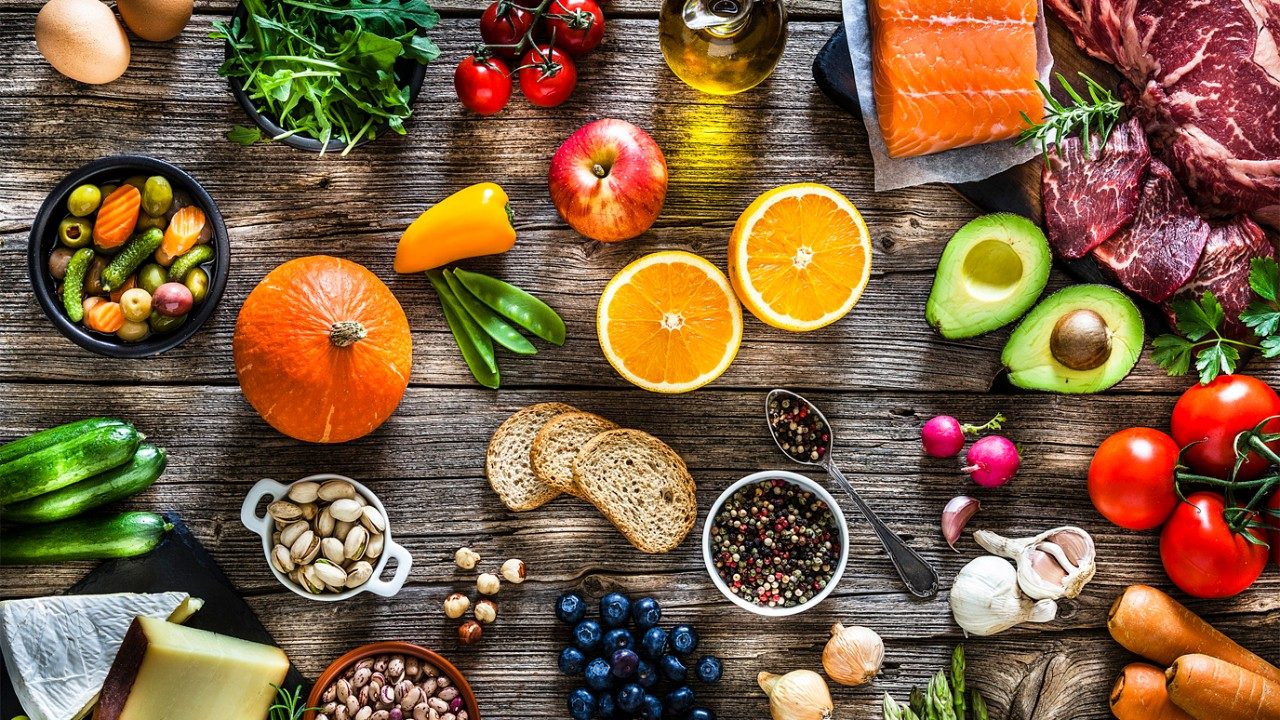 Bird's eye view of a colorful fresh produce arrangement on a table top