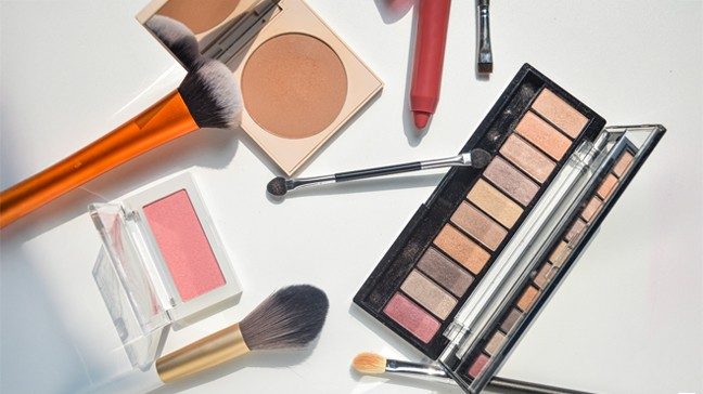 Power blush, bronzer, and eye shadow with makeup brushes