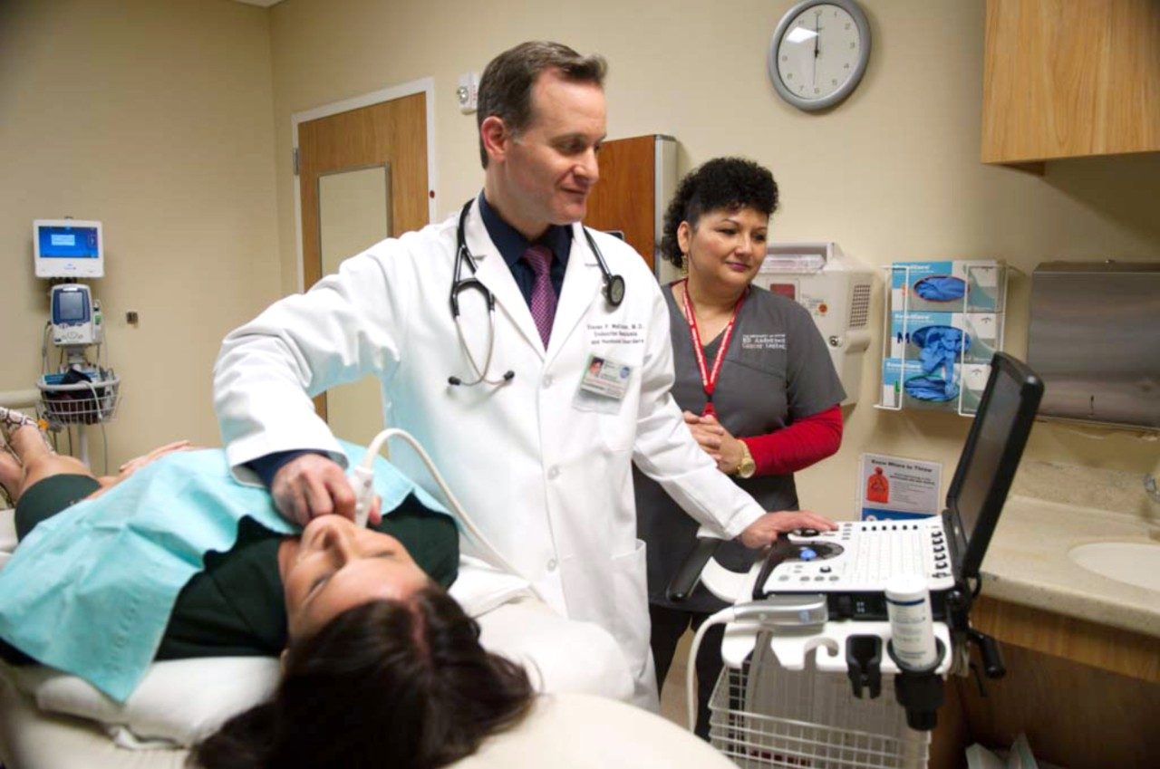 Dr. Steven Weitzman uses an ultrasound to find a thyroid nodule on a patient.