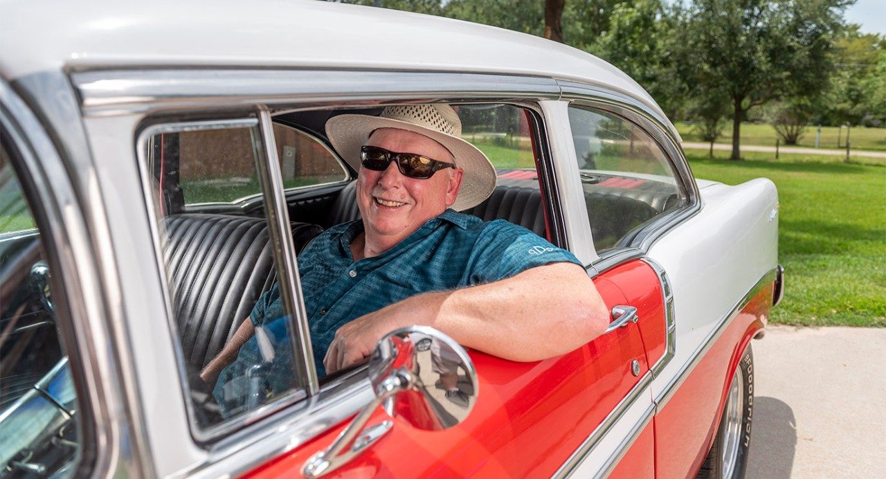 Gary Price in a vintage car