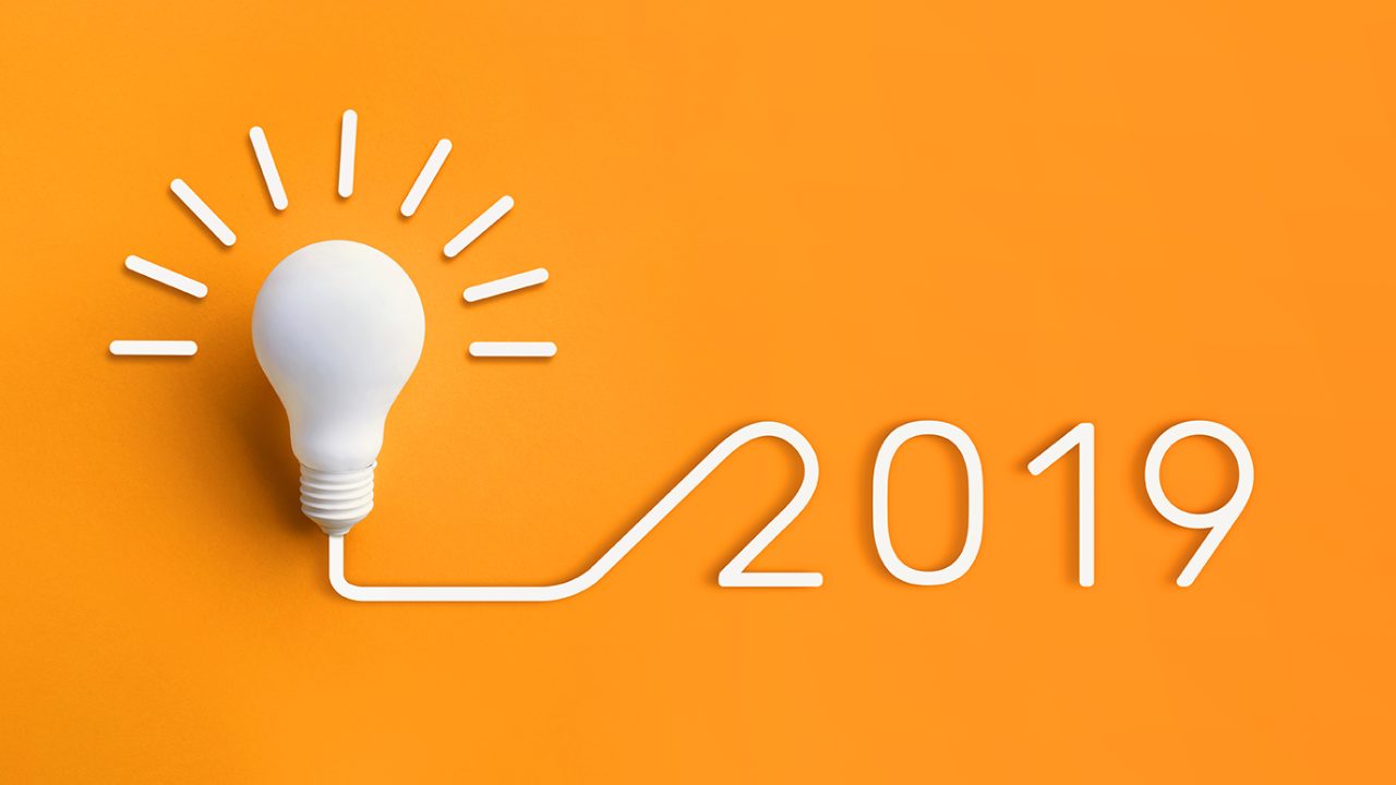 Orange background with light bulb and text: 2019