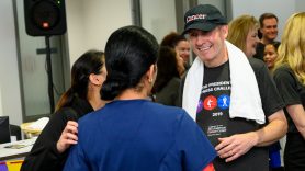 MD Anderson President Peter WT Pisters, M.D., talks with employees at the annual President's Fitness Challenge.