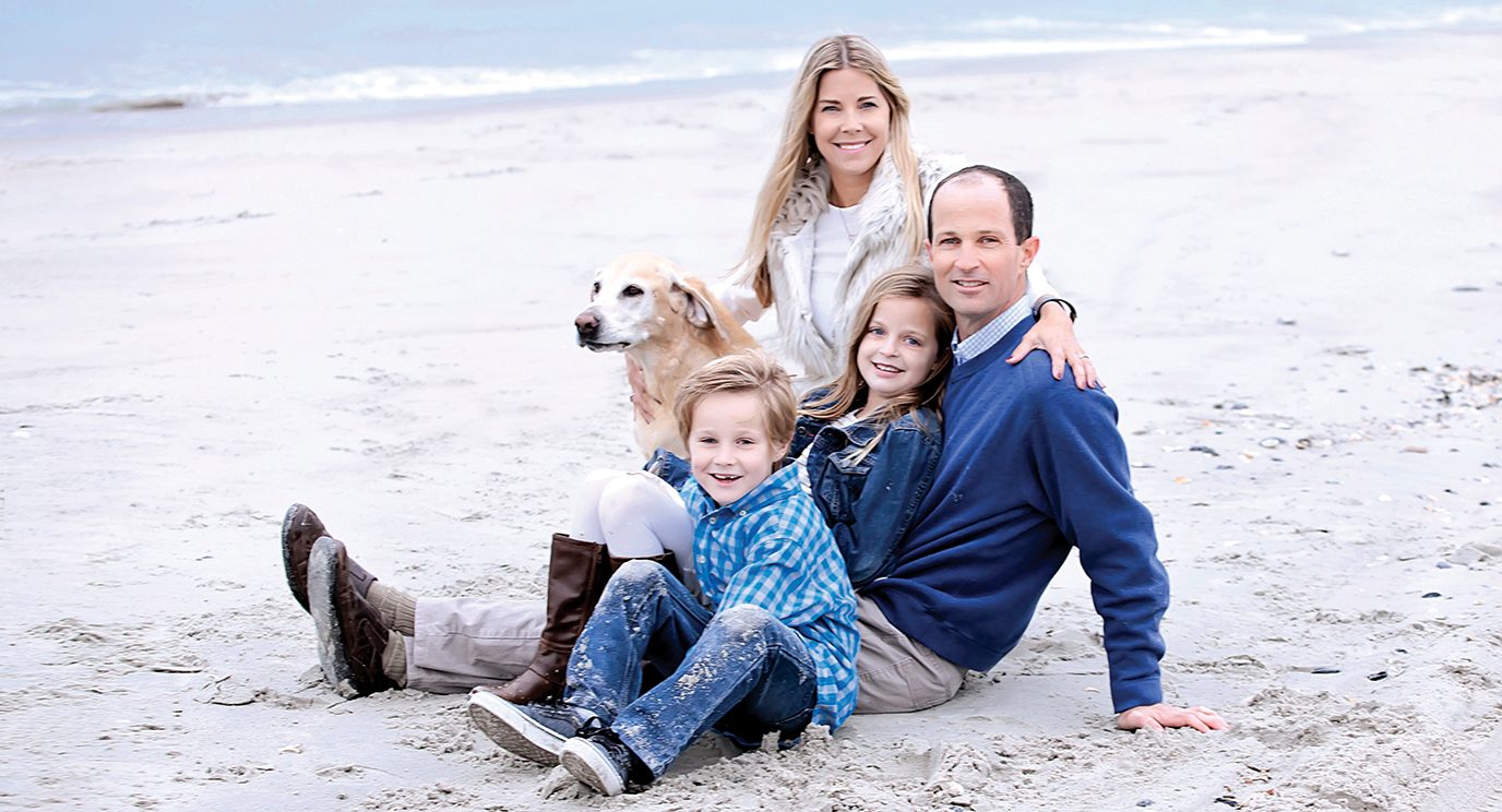 Melanoma survivor Brian Pinckard and family enjoy time on the beach together.